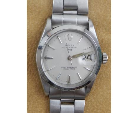 A Rolex Oyster Date stainless steel gentleman's chronometer, having stainless steel bracelet, the silvered dial having baton 