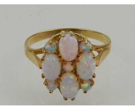 A gold-plated silver and opal cluster ring. 