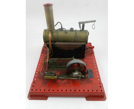 A Mamod static live steam engine, driving a doubled piston fly-wheel, base W. 22cm