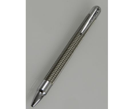 A Tag Heuer stainless steel ball point pen, having engine turned design