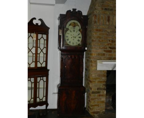 An early Victorian mahogany longcase clock, the case with broken swan neck pediment above spiral carved pilasters and columns