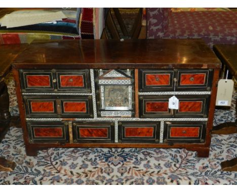 A late 17th/ early 18th century Anglo-Portuguese mahogany and tortoiseshell cabinet, having a central mirrored cupboard with 