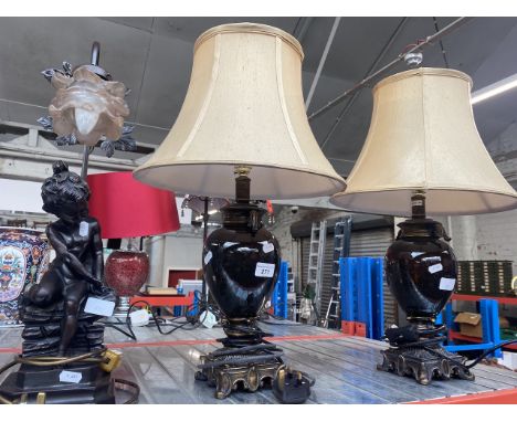 A pair of lamps and a figural lamp. 