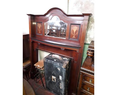 An Edwardian inlaid mahogany and mirror back fire surround. 