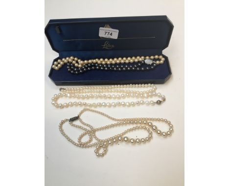 Lotus box containing 5 various pearl necklaces, cultured, baroque, etc - all with silver closures. 