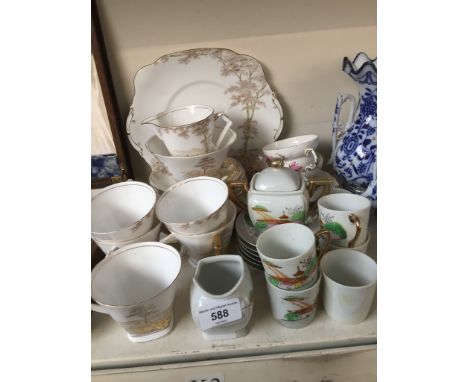 A Royal Standard Daisyfield part tea service, two bone china cups and saucers and a Japanese porcelain tea service. 