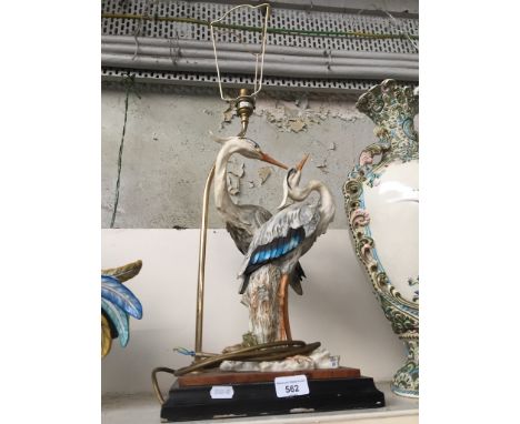 A Capodimonte table lamp featuring a pair of wading birds, G Armani plaque on base 