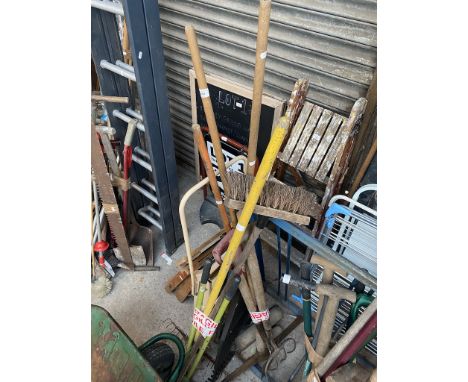 2 bundles of tools including brushes and pick axe 