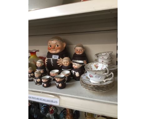 A collection of Goebel monks (11) and items of Royal Doulton china cups and saucers 