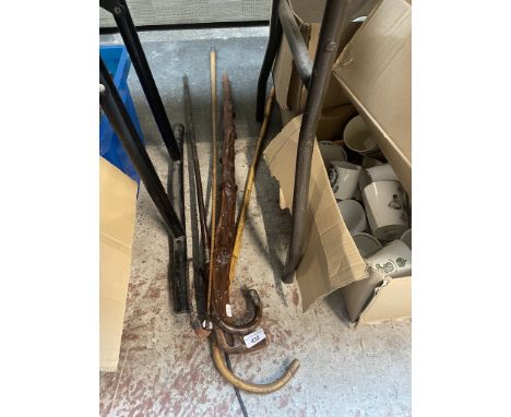 3 walking sticks including one with silver collar and top. Also includes a whip 