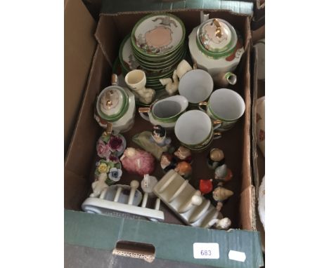 A box of mixed ceramics to include Lurpak toast racks and eggcups, Wade characters The &amp; Dwarves, together with Snow Whit