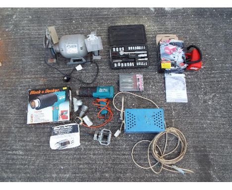 A collection of various tool to include a Hilka 6" bench grinder 1/2 HP 3000 rpm, a hot air gun, battery charger and similar.