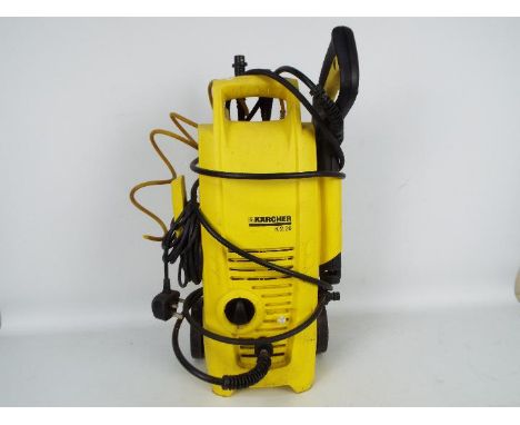 A Karcher pressure washer K 2.36 with two cleaning nozzles.