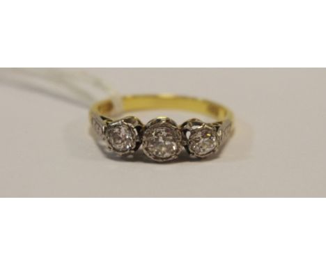 A lady's diamond three stone ring, old cut stones, 18ct gold shank