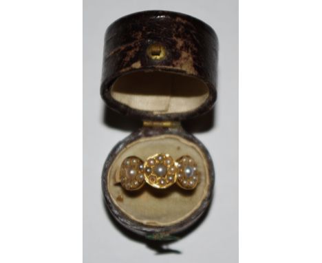 A late 18th early 19th century 18ct gold ring set with seed pearls, size P, hallmarked with a crown, Chester, 18ct and letter