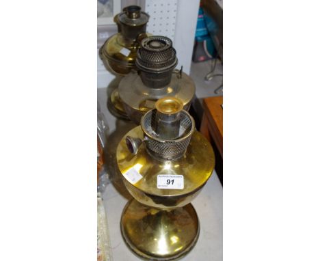 An Aladdin model 12 oil lamp; a super Aladdin oil lamp and a Famos oil lamp (3)
