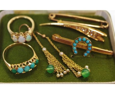 An 18ct gold ring set with five graduating oval turquoise cabochons, size U, 3.6g; a 9ct gold bar brooch surmounted with a ho