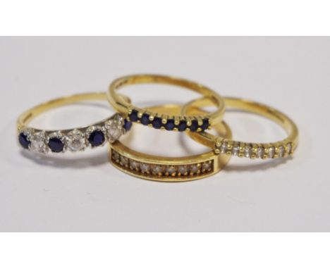 Rings - a white stone set 14ct gold line ring, stamped 585; other, mixed stones, 11g gross (4)