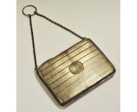 A ladies silver evening purse, engine turned, the interior with pencil, suspension chain, 10.5cm, Birmingham 1946