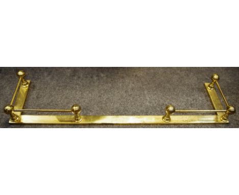 A brass fire fender