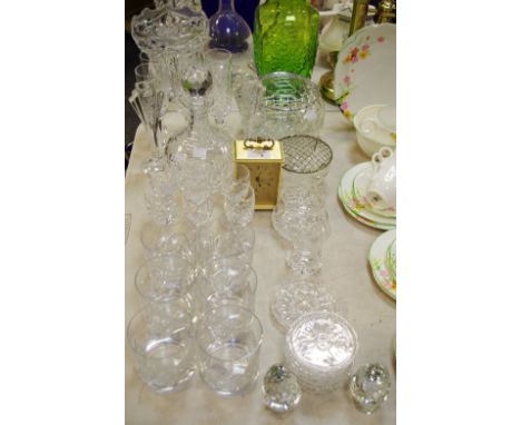 A cut glass decanter and six liqueur tots; other assorted cut glass, drinking glasses; a brass Swiza carriage clock, qty