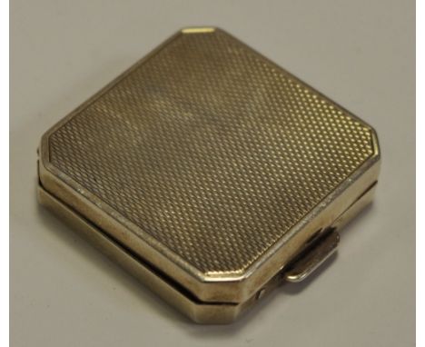 An Elizabeth II silver canted square pill box, engine turned overall, 3.5cm wide, Birmingham 1956