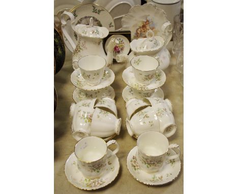 A Royal Albert Howarth pattern part tea service for eight;a coffee pot, two coffee cans and saucers; Royal Doulton Christmas 