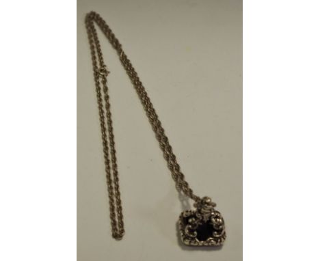 A silver fob on chain