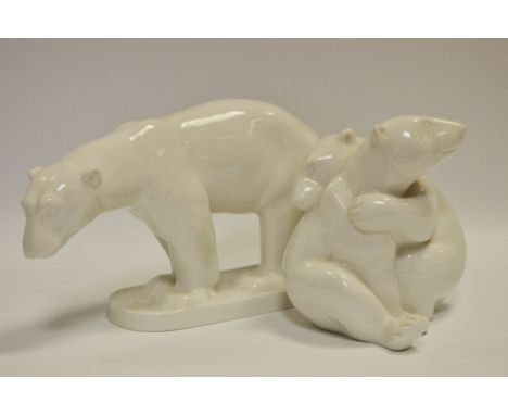 A KPM porcelain model of a walking polar bear, printed marks to base; another KPM model of playing polar bear cubs (2) 