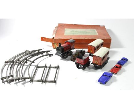 A Brimtoy O gauge tin plate train set to include, locomotive and tender (133), two coaches (2764), oval track and box togethe