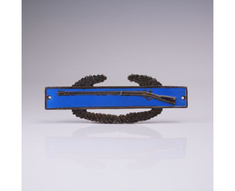 This original World War II Combat Infantry Badge is crafted in sterling silver and showcases a distinctive blue enamel rectan