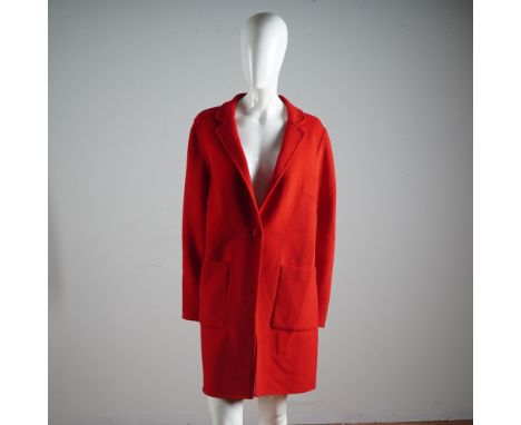 Ignite your wardrobe with this striking St. John coat in an electrifying shade of scarlet. Crafted with precision and eleganc