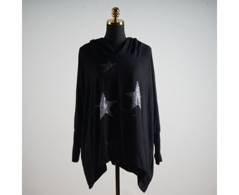Shimmering under the light like a midnight sky, this dramatic black poncho by Olivia Wendel is a striking wardrobe piece that