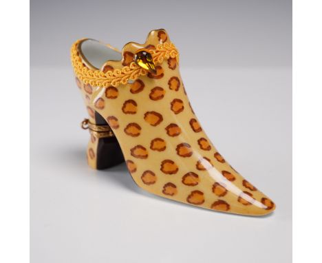 This Limoges France porcelain shoe figurine features a bold leopard print design in warm amber and brown tones, highlighted b
