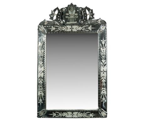 An elegant antique Venetian style wall mirror featuring etched floral and foliate designs across a segmented glass border and