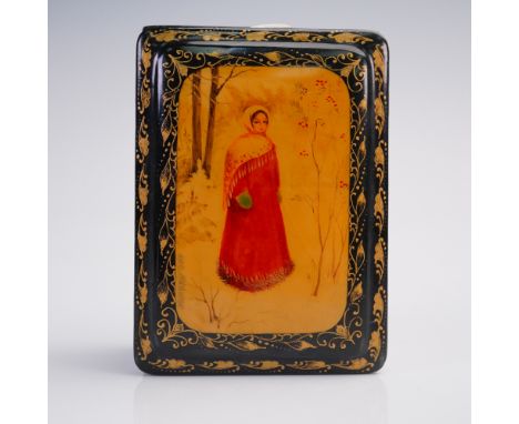 This finely crafted Russian lacquer box features a hand-painted scene of a maiden in a red winter coat and shawl, standing am