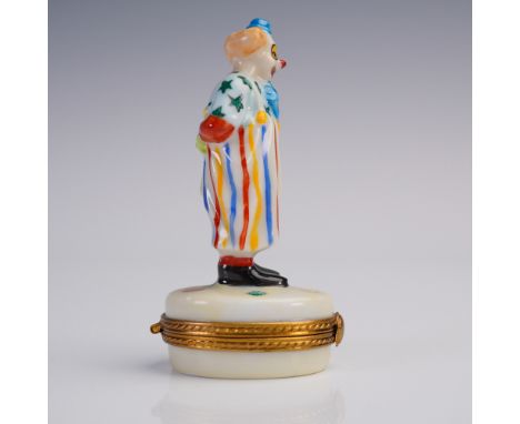 Hand-painted Limoges porcelain trinket box in the form of a whimsical clown, dressed in a vibrant multi-colored costume with 