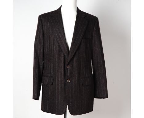 Classic and refined, this Paul Stuart men's blazer is tailored from richly textured wool in a deep espresso brown hue with fi