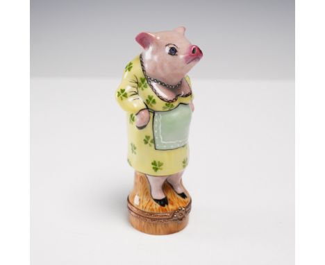 Whimsical hand-painted porcelain trinket box from Limoges France, modeled as a pig standing upright in a clover-printed yello
