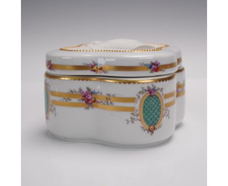 A finely crafted porcelain dresser box by KPM Berlin, featuring elegant hand-painted floral garlands, raised gilt accents, an