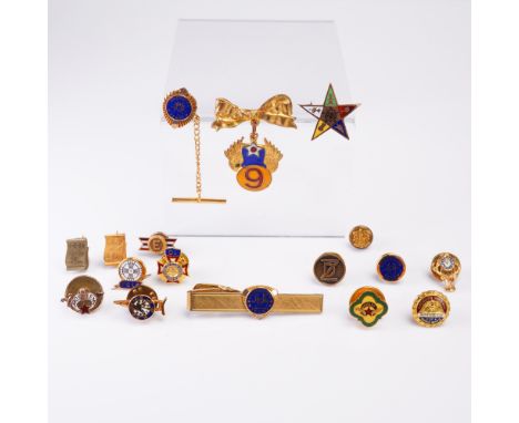 This assorted 18-piece collection includes vintage enamel service pins, fraternal emblems, and commemorative badges, many in 
