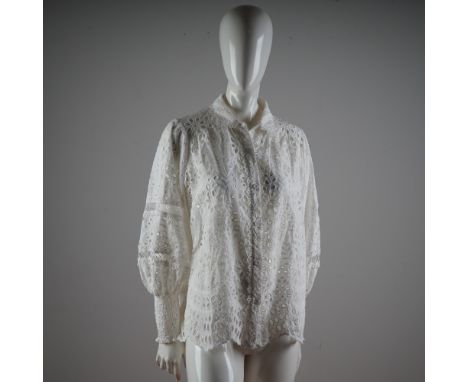 A romantic and ethereal creation from Miss June Paris, this stunning blouse radiates bohemian elegance with its exceptional c