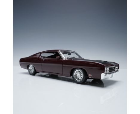 Highly detailed 1:18 scale model of the 1969 Ford Torino Talladega by Maisto, finished in deep maroon with a matte black hood