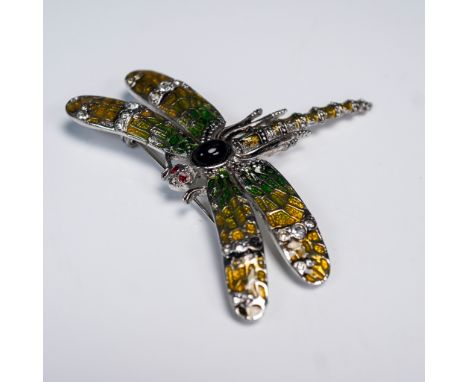 Silver tone dragonfly brooch by Landau featuring vibrant enamel wings in shades of green and yellow, accented with clear rhin