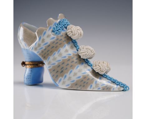 Hand-painted porcelain shoe figurine designed by Fiona Saunders and crafted in Limoges, France. This charming piece, labeled 