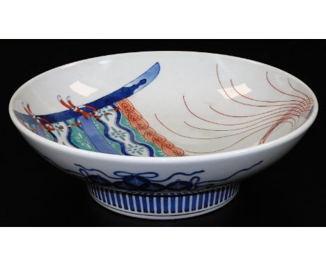 A large Japanese Nabeshima dish, decorated with a hanging textiles and a tassel in red, green and underglaze blue, the revers