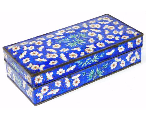 A Chinese 19thC enamel two compartment pen box and cover, decorated with prunus and bamboo on a cracked ice blue ground. 19.5