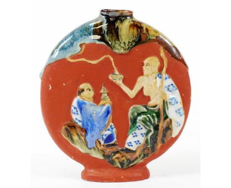 A small early 20thC Japanese Sumidagawa pottery moon flask, decorated with raised figures, 13cm H.  There is no apparent dama