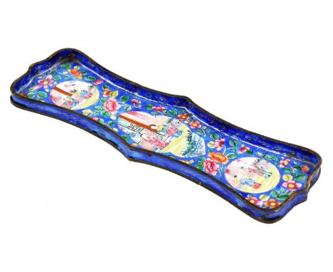 A late 19thC Chinese enamel shaped rectangular pen tray, decorated with panels of figures in cartouches within polychrome flo