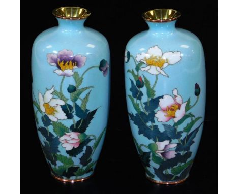 A pair of Meiji period Japanese cloisonne vases, each of shouldered form, decorated with poppies on a light blue ground, unma